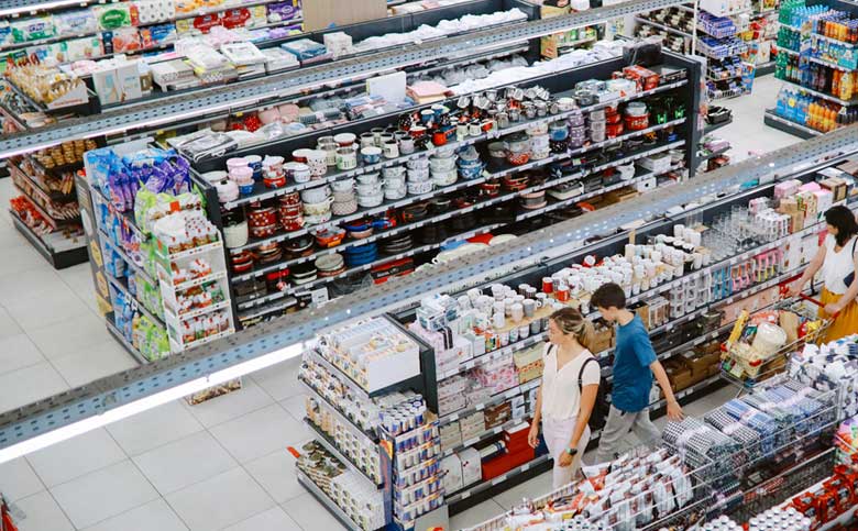 shoppers walking aisle at Walmart